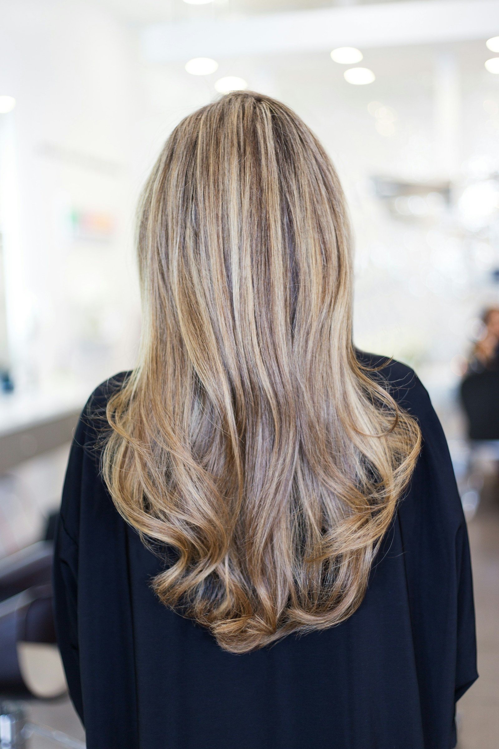 Long, multi-tonal blonde hair seen from behind